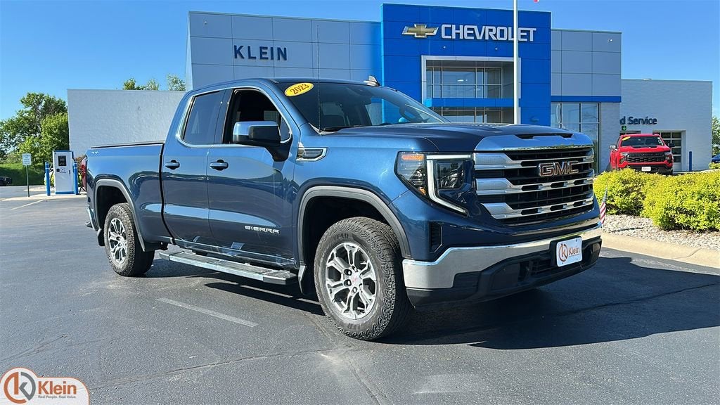 2023 GMC Sierra 1500 SLE in Pacific Blue Metallic — front three-quarter view