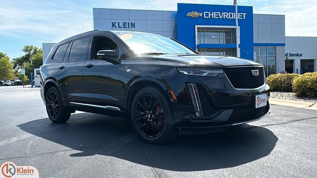 2024 Cadillac XT6 Sport in Stellar Black Metallic — front three-quarter view