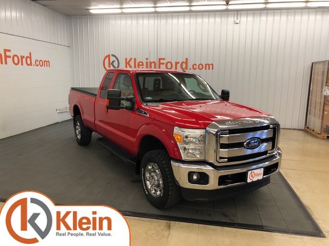 2015 Ford F-350SD Lariat in Vermillion Red — front three-quarter view