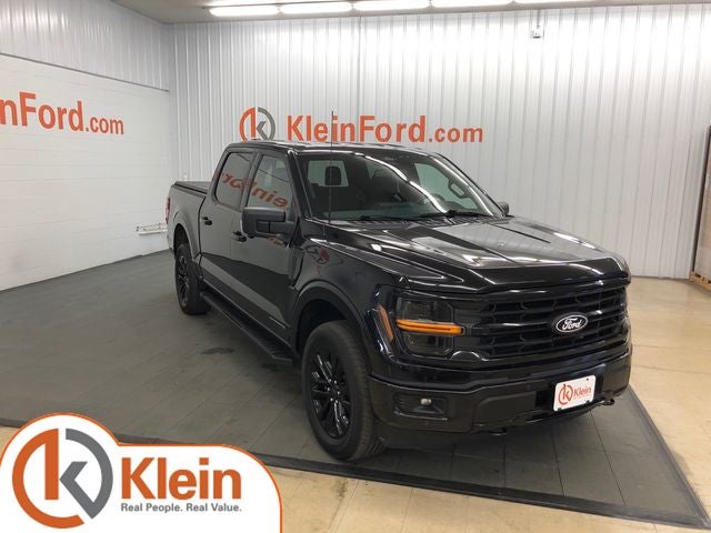 2024 Ford F-150 XLT in Black Metallic — front three-quarter view