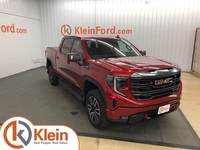 2024 GMC Sierra 1500 AT4 TECH PACKAGE/ROOF/PREMIUM PACKAGE in Volcanic Red Tintcoat — front three-quarter view